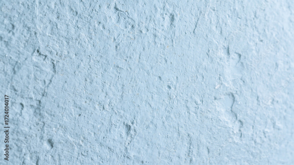 Fototapeta premium Textured light blue and pale green abstract surface with subtle relief and uneven patterns perfect for backgrounds and design elements