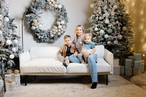 Mother posing with children for christmas photo