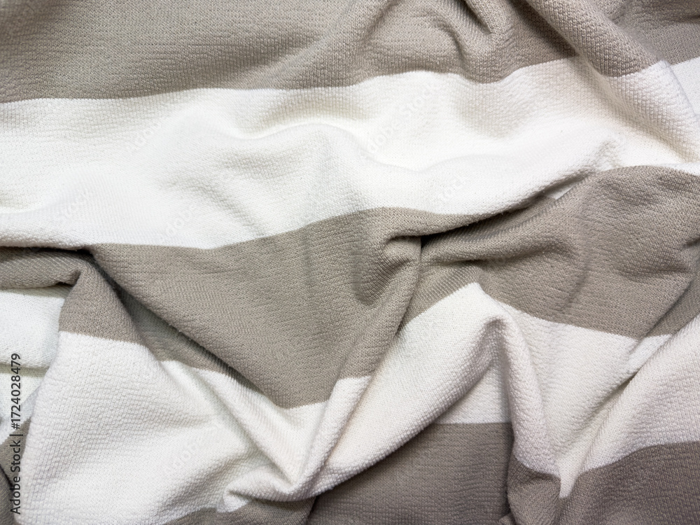 Fototapeta premium Fabric close up, white and beige, light fabric, cotton, clothing, flat lay, copy space, top view. High quality photo