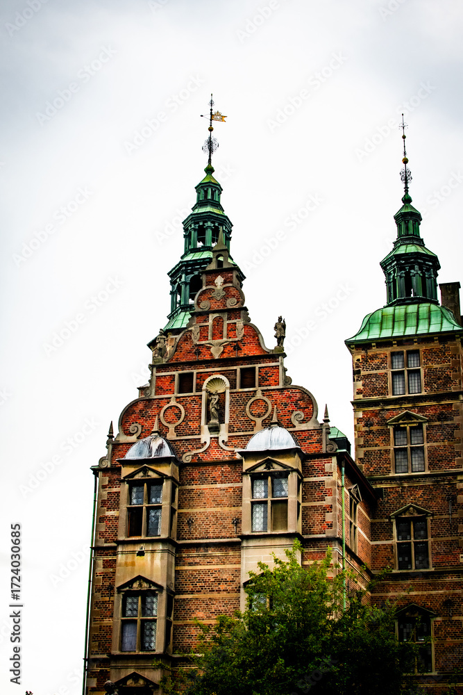Obraz premium Detailed architecture of a historic Danish castle under a cloudy sky in Denmark