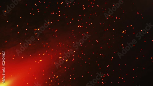 Animated fire texture with a moving background. Yellow, red, and orange flames glow with fiery combustion, with bright sparks, isolated on a black background.