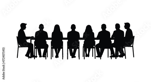 Group of people seated around a table in dark silhouette