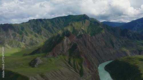Aerial view of the mountain river between the mountains