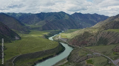 Aerial view of the mountain river between the mountains