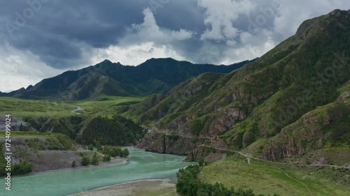 Aerial view of the mountain river between the mountains