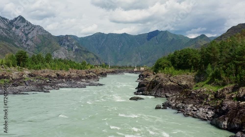 Aerial view of the mountain river between the rocks