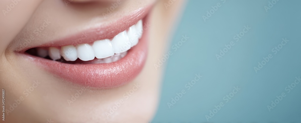 Fototapeta premium The smile of a healthy person showing bright white teeth and soft pink lips