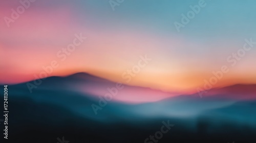 Blurry sunset over misty mountains (1)