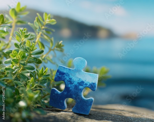 Puzzle piece on a rock by the ocean