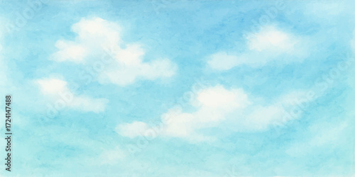 Fluffy white clouds drift across a bright blue sky on a clear summer day