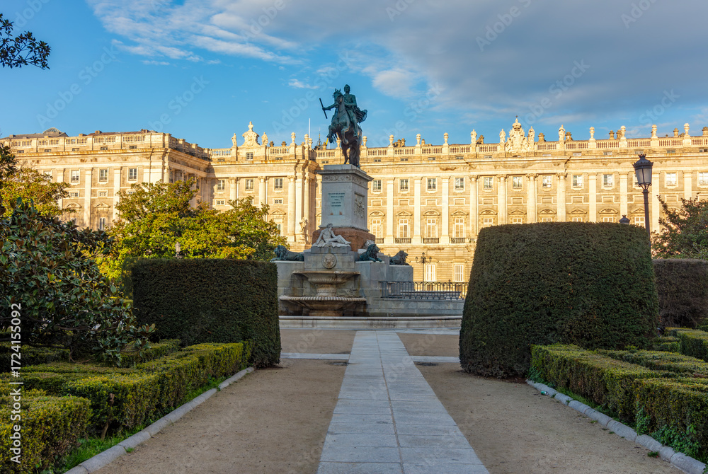 Fototapeta premium Monument to Felipe IV on Eastern square (Plaza de Oriente) and Royal palace of Madrid, Spain