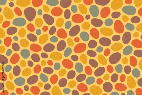 A playful, abstract pattern featuring rounded shapes in warm autumnal hues like orange, yellow, and brown, creating a lively and dynamic design.