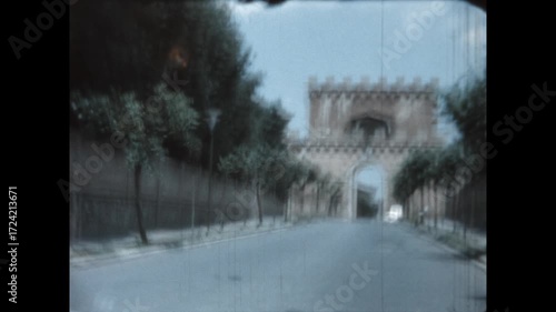 Porta Romana in Siena 1964 - First person view from a car as it approaches Porta Romana, one of the portals in the medieval walls of Siena, Italy, in 1964.