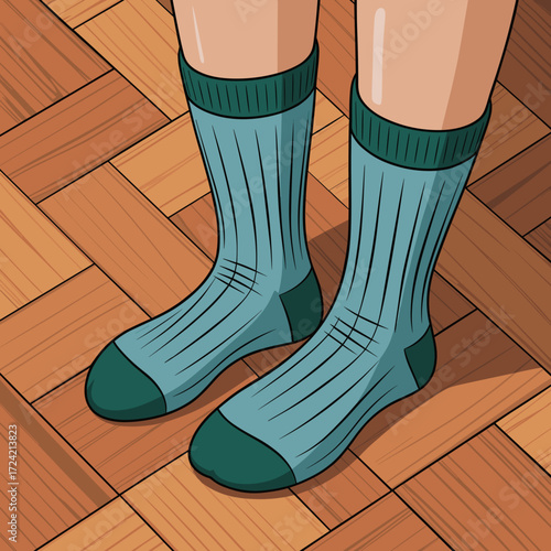 Cozy teal socks on bare feet standing on wooden parquet floor  