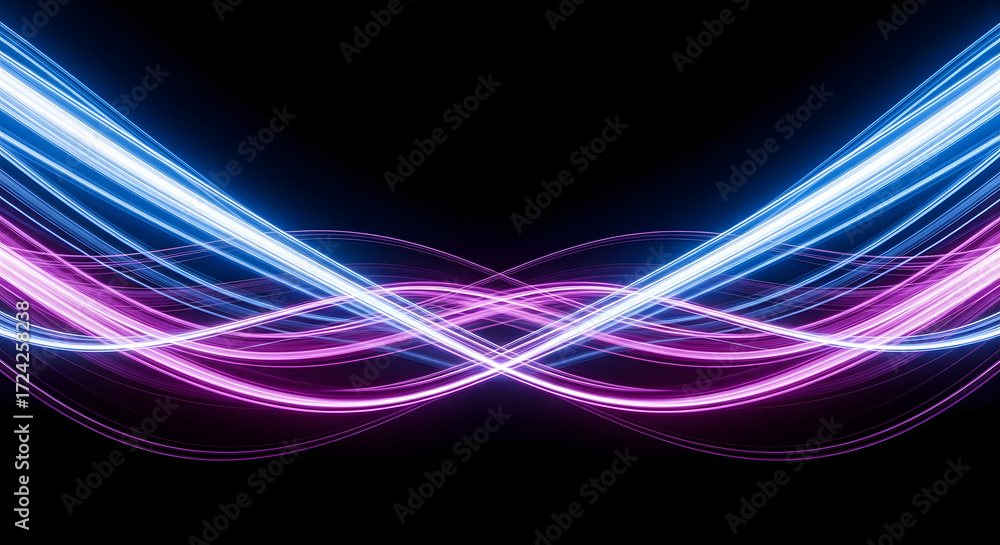 Fototapeta premium Abstract light trails in blue and purple on a black background.