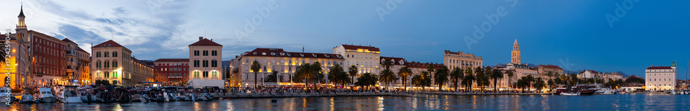 Fototapeta premium Summer evening on embankment of port city, panorama. On coast of Adriatic Sea is port of Split. Parking of watercraft in Adriatic Sea, parking place for yachts and ships...