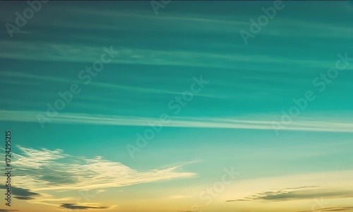 Sunset Sky with Soft Cloud Movements Over Calm Horizon in Warm Tones