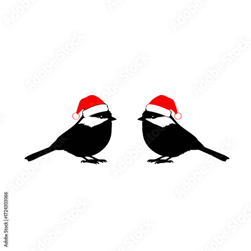 Two chickadees wearing Santa hats
