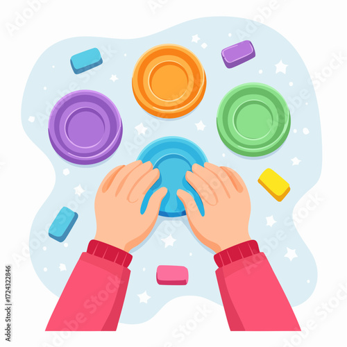 Child's Hands Playing with Colorful Playdough and Shapes