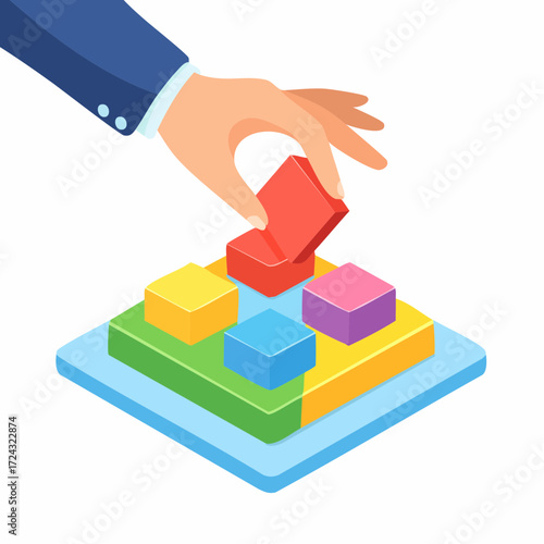 Hand Placing Red Block on Colorful Building Blocks
