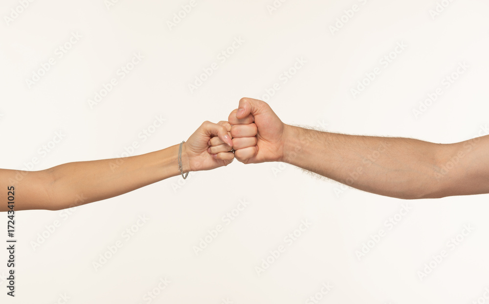 Fototapeta premium Rock-paper-scissors gesture shown by male and female hands