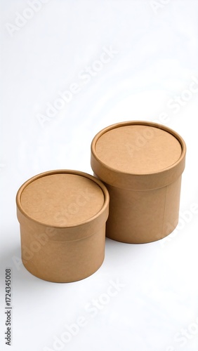 Two round cardboard boxes, light beige, stacked