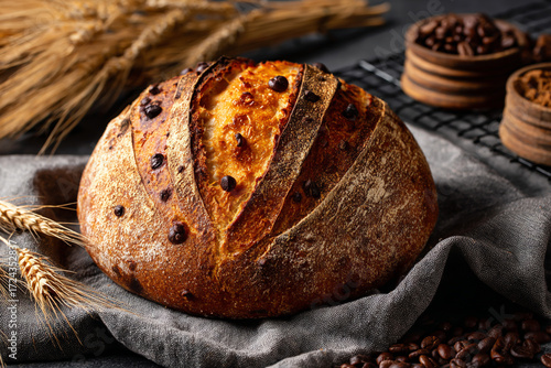 Artisan sourdough bread with chocolate chips on a rustic table