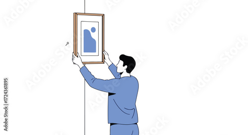 Man meticulously hanging an abstract painting on a pristine white wall to enhance interior ambiance