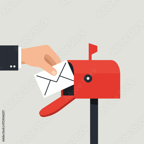 Letter being mailed in red mailbox