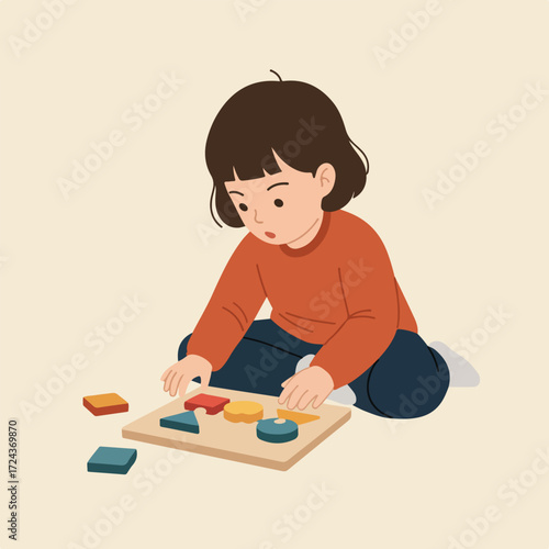 Child plays with colorful shapes on a puzzle board, seated on the floor