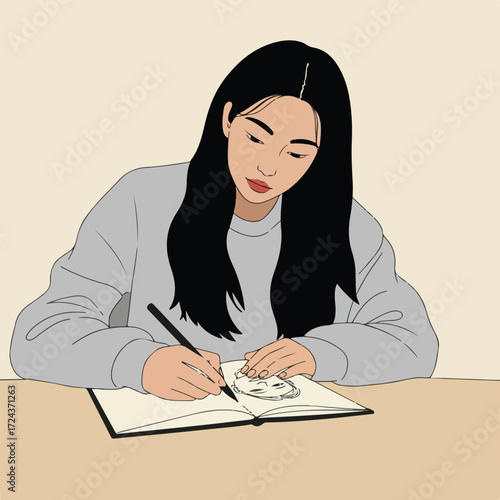 Woman with long hair drawing a face in sketchbook at desk