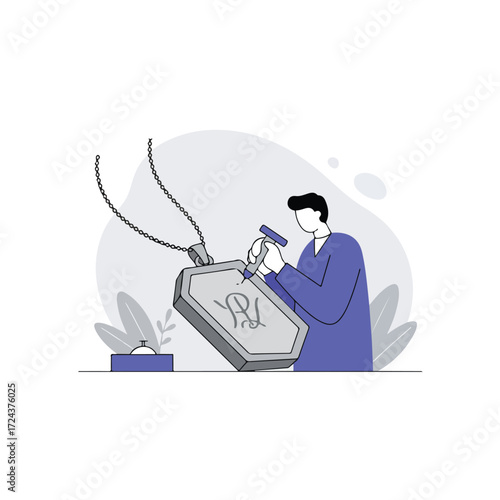 Man engraving pendant with initials, chain, and leaves nearby