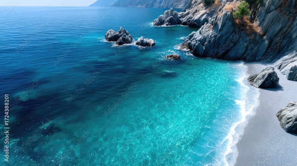 Fototapeta premium Aerial View of Turquoise Sea and Rocky Coastline in Sunny Weather Coastal Scenery with Crystalline Water Sparkling Under Clear Sky