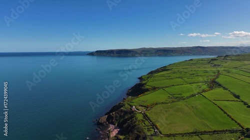 Aerial Drone view of the Beautiful Rolling hills of the coast of Ireland on the Irish Sea 