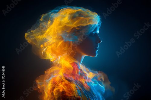 Profile of a person enveloped in vibrant, flowing blue and orange light waves against a dark background, creating an ethereal and dynamic visual effect