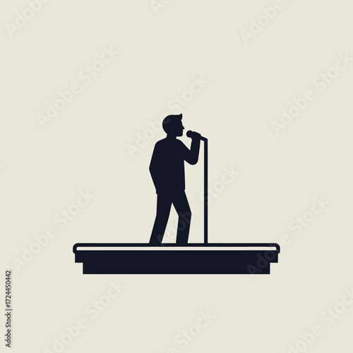 Silhouette of a person singing into a microphone on a stage.