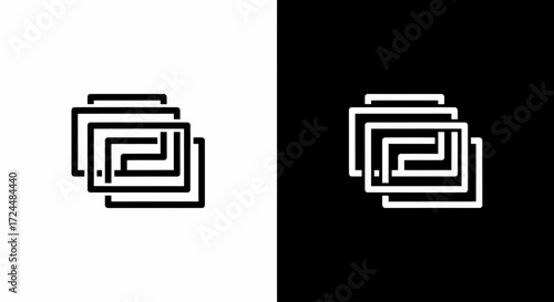 Geometric Puzzle: A symmetrical black and white design features interconnected linear shapes forming a structured pattern.