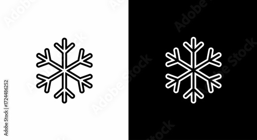 Snowflake in Monochrome: A striking, minimalist depiction of a delicate snowflake, showcasing its intricate symmetry against a contrasting backdrop of black and white.