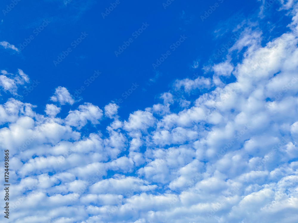 Obraz premium Bright blue sky background. Beautyful blue sky with white clouds.