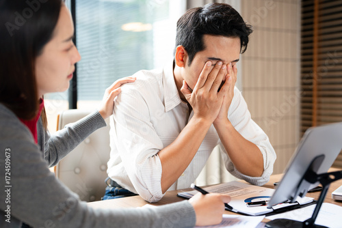 Fotografie Stressed  team with problem no solution at meeting, partners holding heads in hands depressed by failure bad news, feeling desperate about company bankruptcy or financial crisis