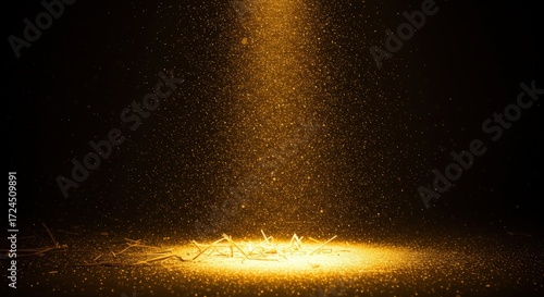 Golden light spotlighting dark surface