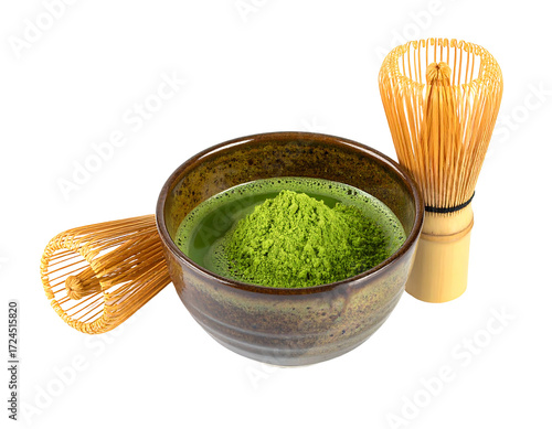 Matcha powder in a small bowl with bamboo whisks