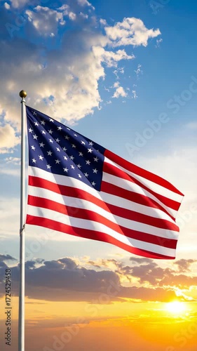 American flag waving in wind with red and white stripes and white stars on blue with clouds and sunset