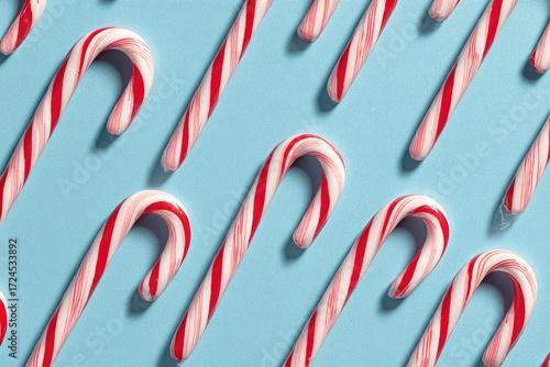 Candy canes arranged in a pattern on a light blue background (3)