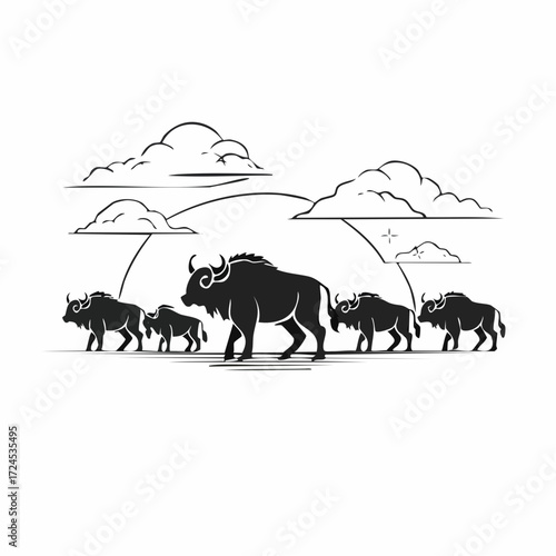 Silhouette of a herd of wild animals migrating across the plains with a sunset in the background