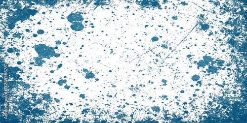 Blue drops and splashing water on a textured glass surface create a colorful and artistic liquid pattern