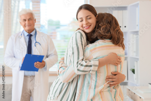 Young lesbian couple huggin...