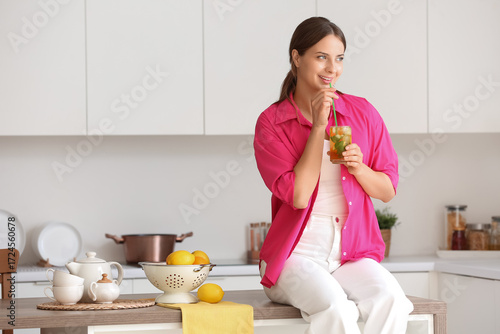 Young woman with ice tea si...