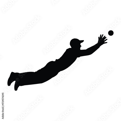 Silhouette of a baseball player diving to catch a ball