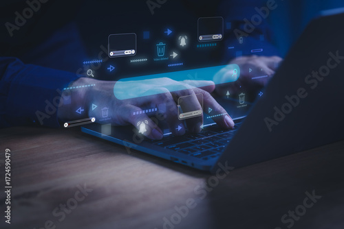 Man using a laptop computer with digital interface for video content moderation. Concept of online streaming, video platform, content removal, copyright protection, AI moderation and digital safety.